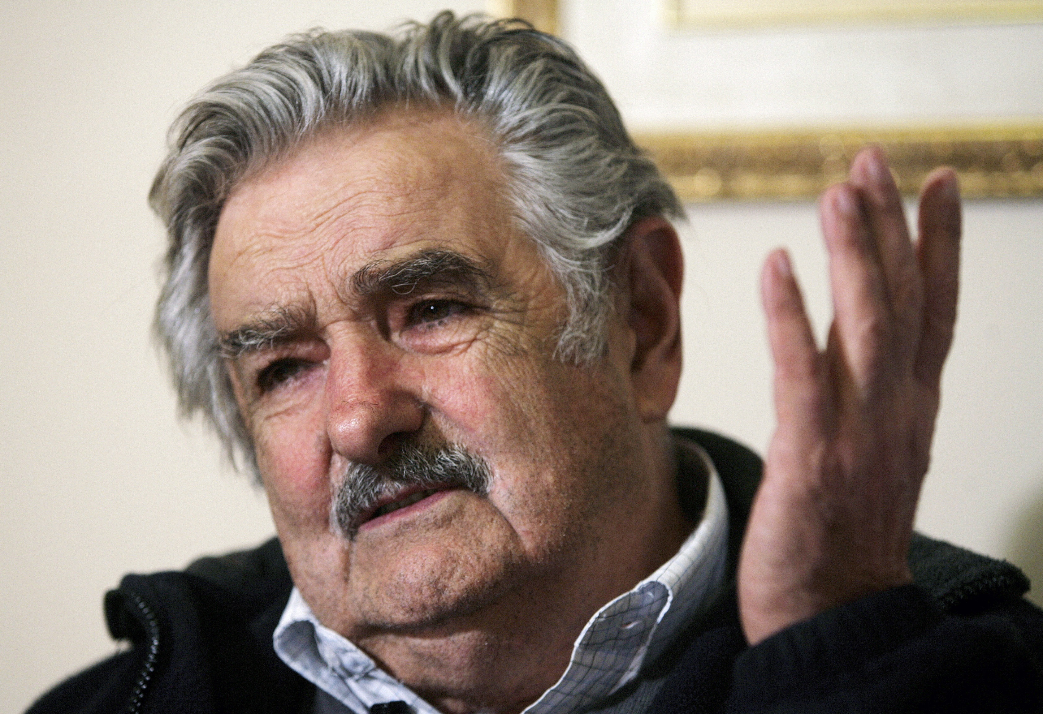 Former guerrilla leader and Uruguay's leading presidential candidate Jose Mujica gestures during a Reuters interview in Montevideo